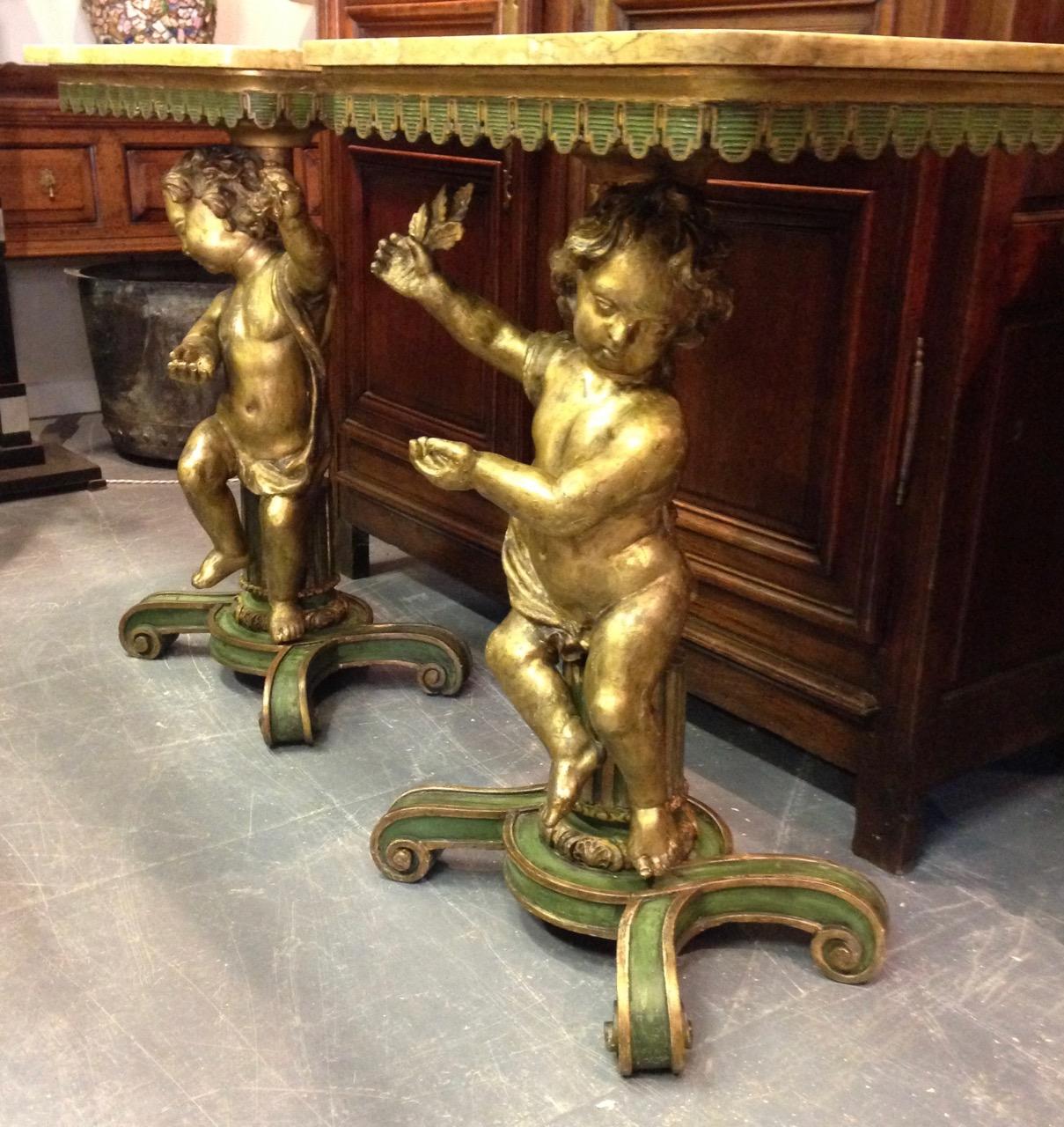 Pair of Gilded and Carved Cherub Console Tables 